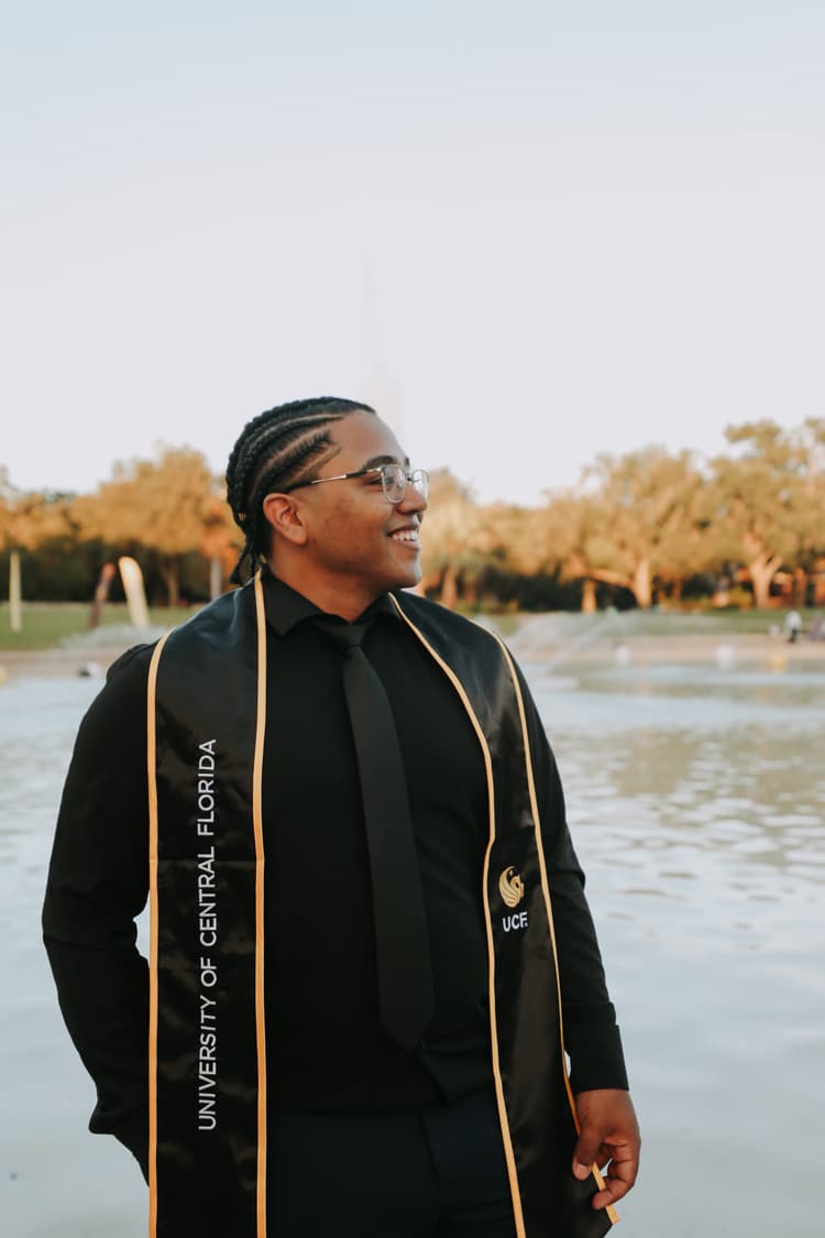 Grad pic of me at the UCF Library Fountain